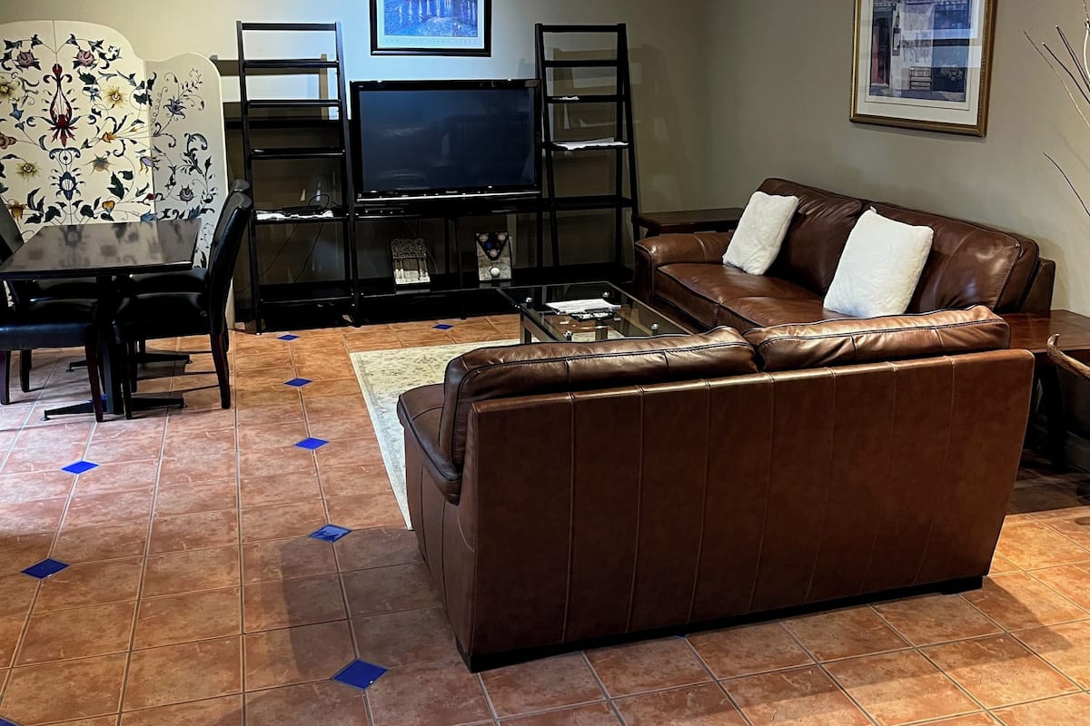 Patio Suite, 1 King Bed and 1 Queen Bed, Fireplace, Kitchenette | 2 bedrooms, soundproofing, iron/ironing board, free WiFi