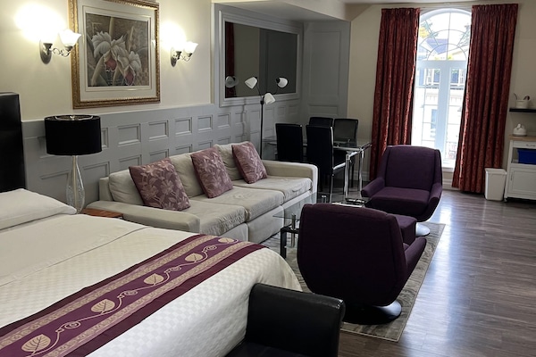 Orchid Suite, 1 King Bed and 1 Sofa Bed, Fireplace, Jetted Tub | Soundproofing, iron/ironing board, free WiFi, bed sheets