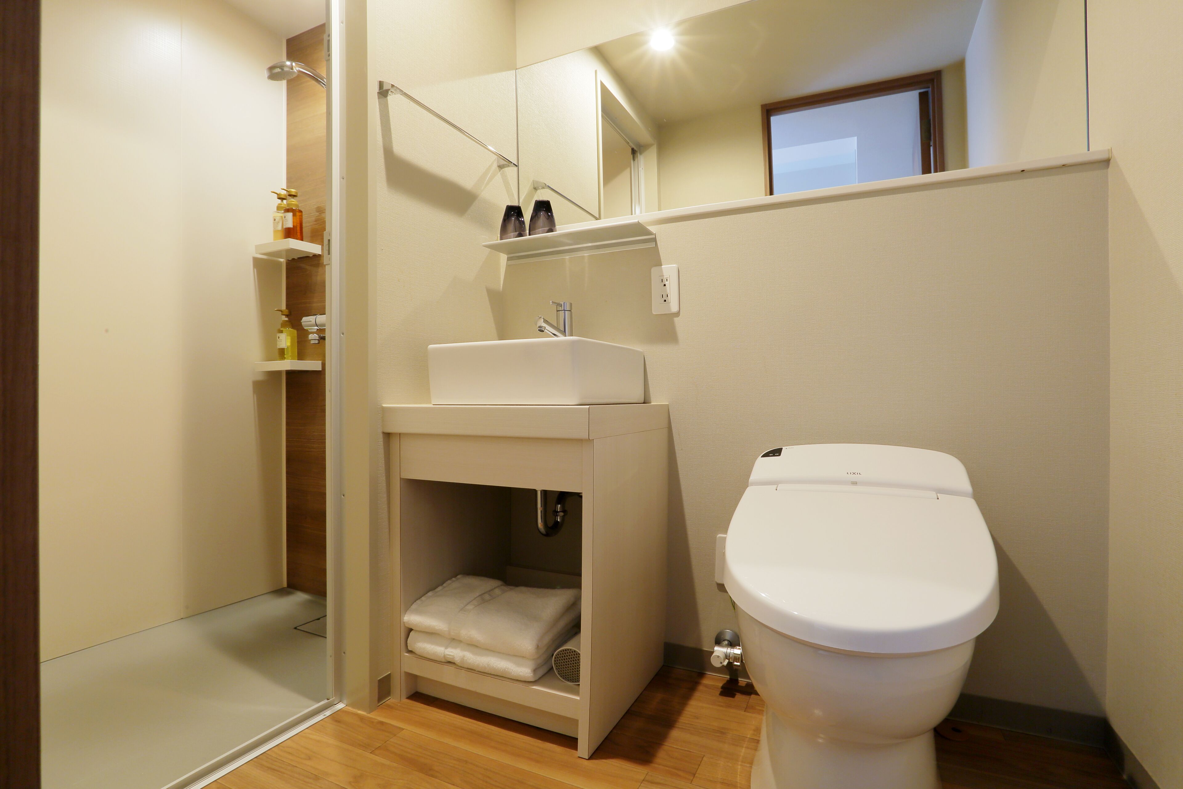 shower, hair dryer, slippers, electronic bidet