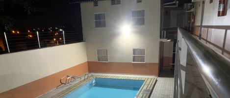 Outdoor pool, open 10:00 AM to 7:30 PM, pool umbrellas, pool loungers