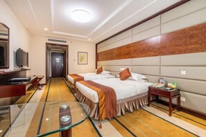 A hotel room with a bed, bedside table, TV, and a glass table. - Dunhuang Hotel (Jiuquan)