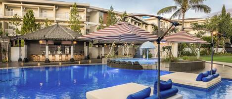 Outdoor pool, pool loungers, lifeguards on site