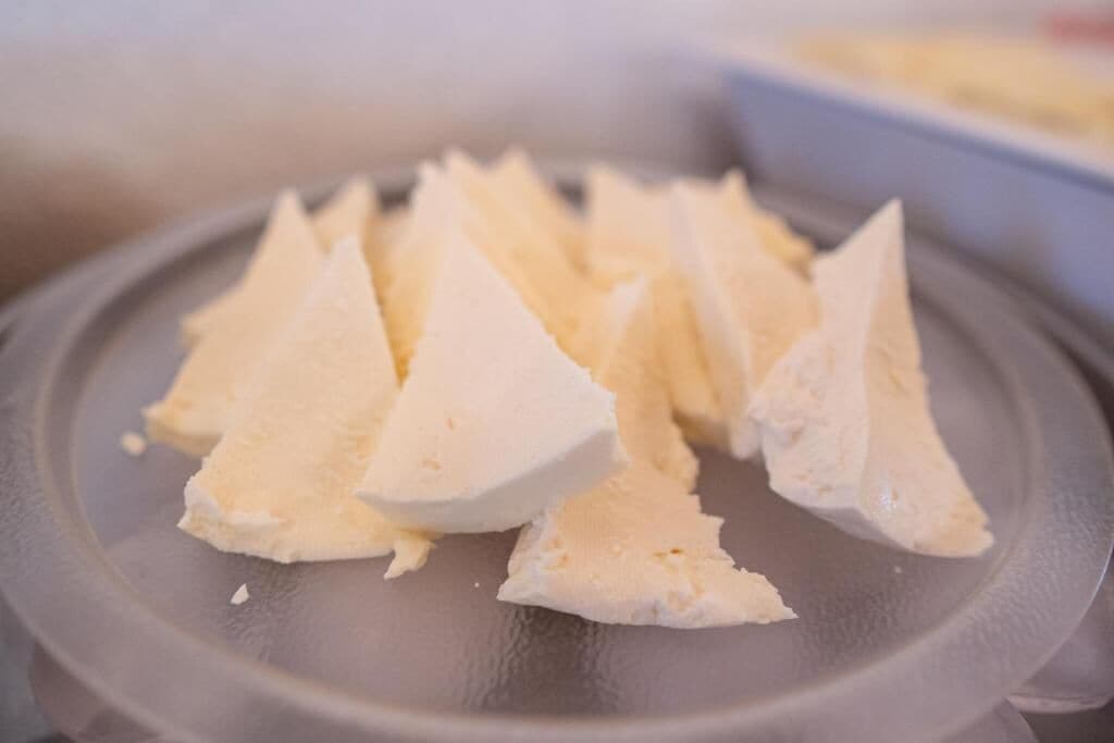 A plate with several triangular pieces of food.