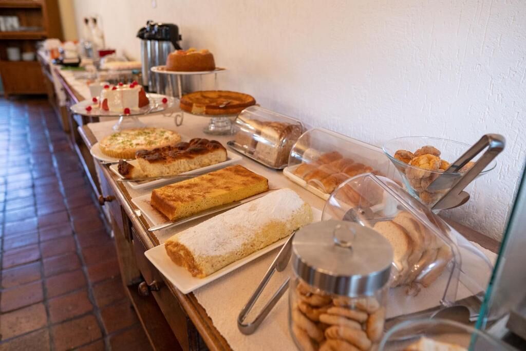 A buffet with various desserts and pastries.