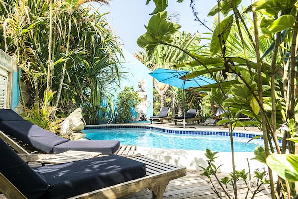 2 outdoor pools, open 7:00 AM to 8:00 PM, pool umbrellas, pool loungers