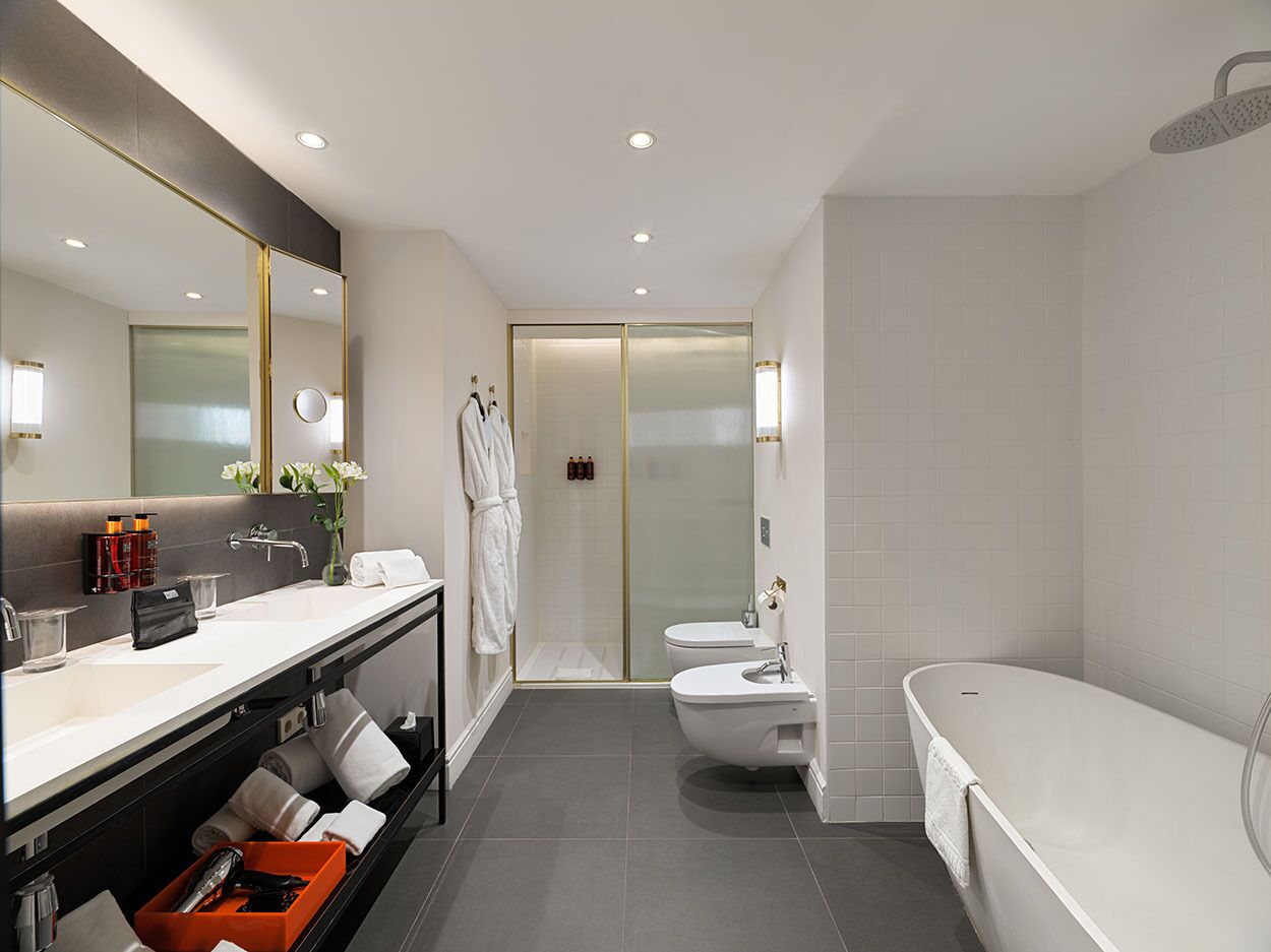 designer toiletries, hair dryer, bathrobes, towels