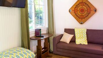 Economy Cottage, 1 Bedroom, Kitchenette, Garden Area (Studio Style) | Living room | 40-inch flat-screen TV with cable channels, TV