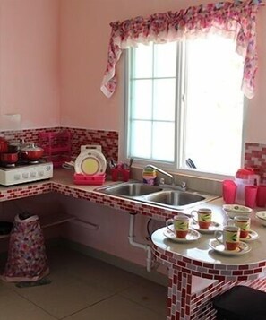 Full-sized fridge, stovetop, coffee/tea maker, cookware/dishes/utensils