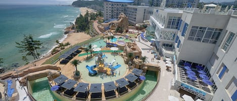 A resort with a water park, beach, and ocean views.