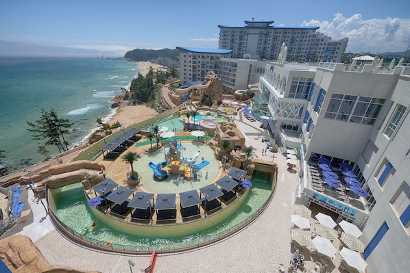 A resort with a water park, beach, and ocean views.
