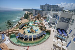 A resort with a water park, beach, and ocean views.