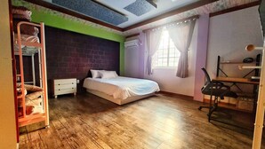A bedroom with a bed, a desk, a chair, a bunk bed, and a window with curtains. - Kimchee Busan Downtown Guesthouse - Hostel (Busan)