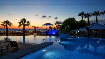 Indoor pool, outdoor pool, pool umbrellas, sun loungers
