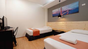 A hotel room with two beds, a desk, and a large painting of a bridge.