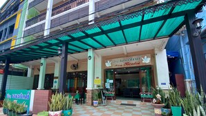 A restaurant with a green awning and a sign that reads "Mixay Paradise". - Mixay Paradise Hotel (Vientiane)