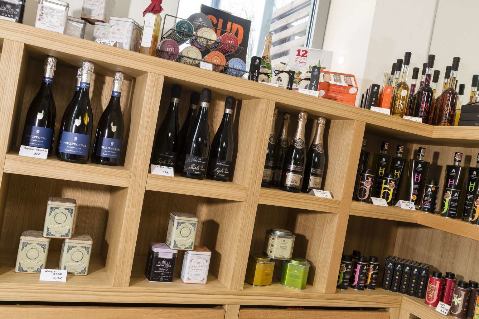 A store with shelves stocked with various bottles of alcohol and toiletries.