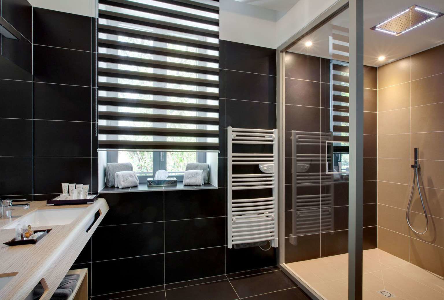 signature suite | bathroom | designer toiletries, hair dryer, bathrobes, slippers