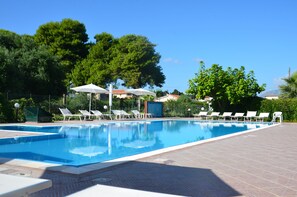 Outdoor pool, open 9:00 AM to 7:00 PM, pool umbrellas, pool loungers