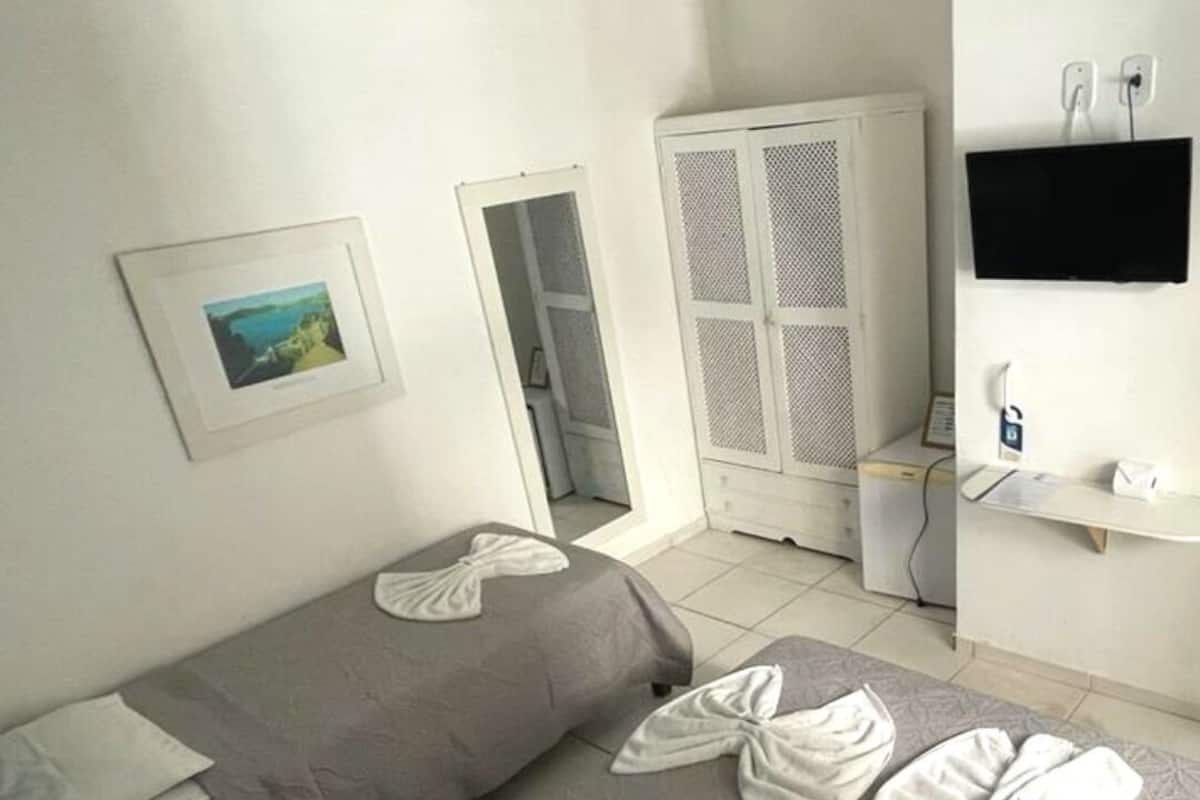 Chambre Triple | Minibar, rideaux occultants, Wi-Fi gratuit, draps fournis