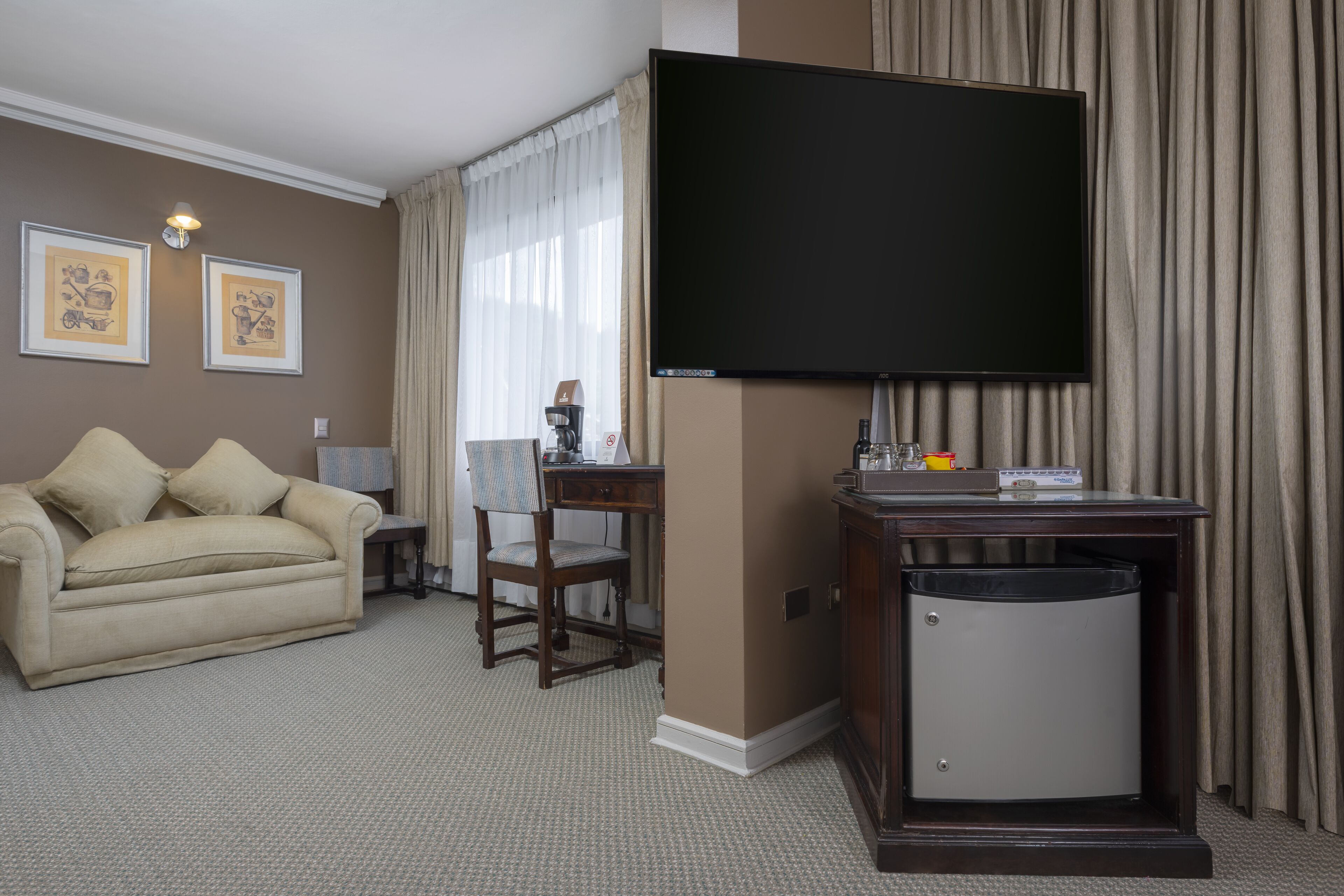 executive twin room | living area | 40-inch smart tv with cable channels