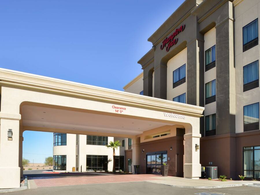 A hotel entrance with a clear sign indicating a 14' clearance.