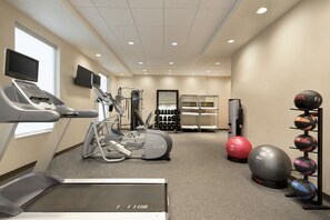 A gym with treadmills, elliptical machines, a stationary bike, and various exercise balls. - Home2 Suites by Hilton Cleveland Independence (Independence)