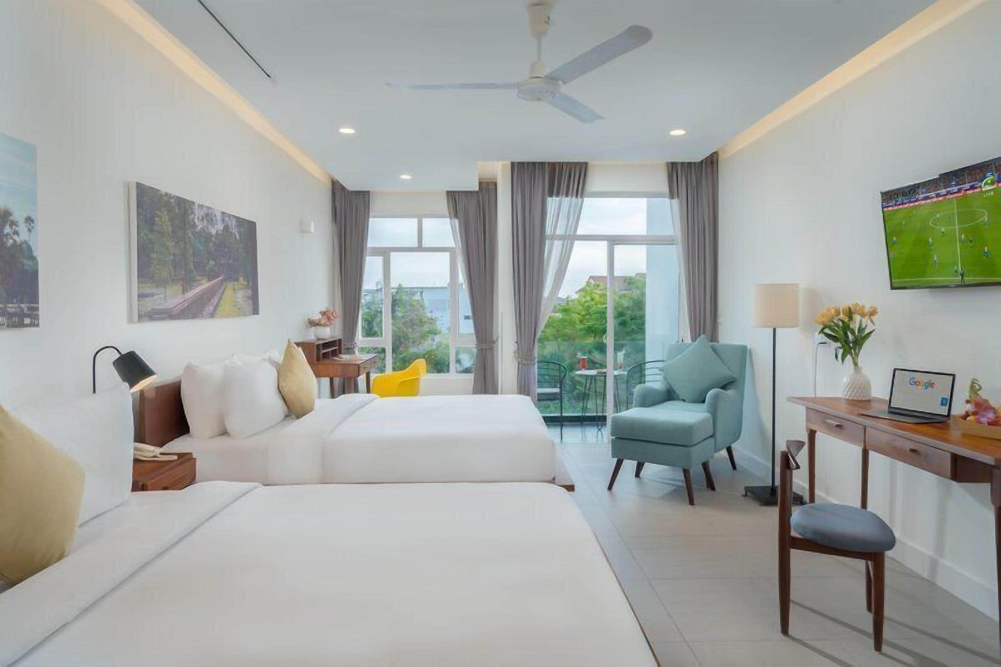 Family Studio, Pool View | Minibar, in-room safe, desk, blackout drapes