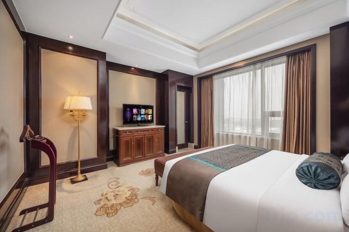 Luxe beddengoed, een minibar, een kluis op de kamer, een bureau
