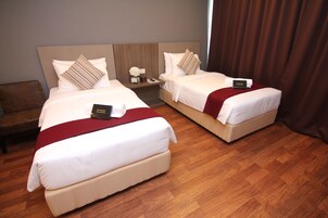Habitación Deluxe, 2 camas individuales | 1 dormitorio y ropa de cama de alta calidad