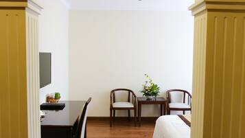 Superior Living Room | Minibar, in-room safe, desk, blackout curtains