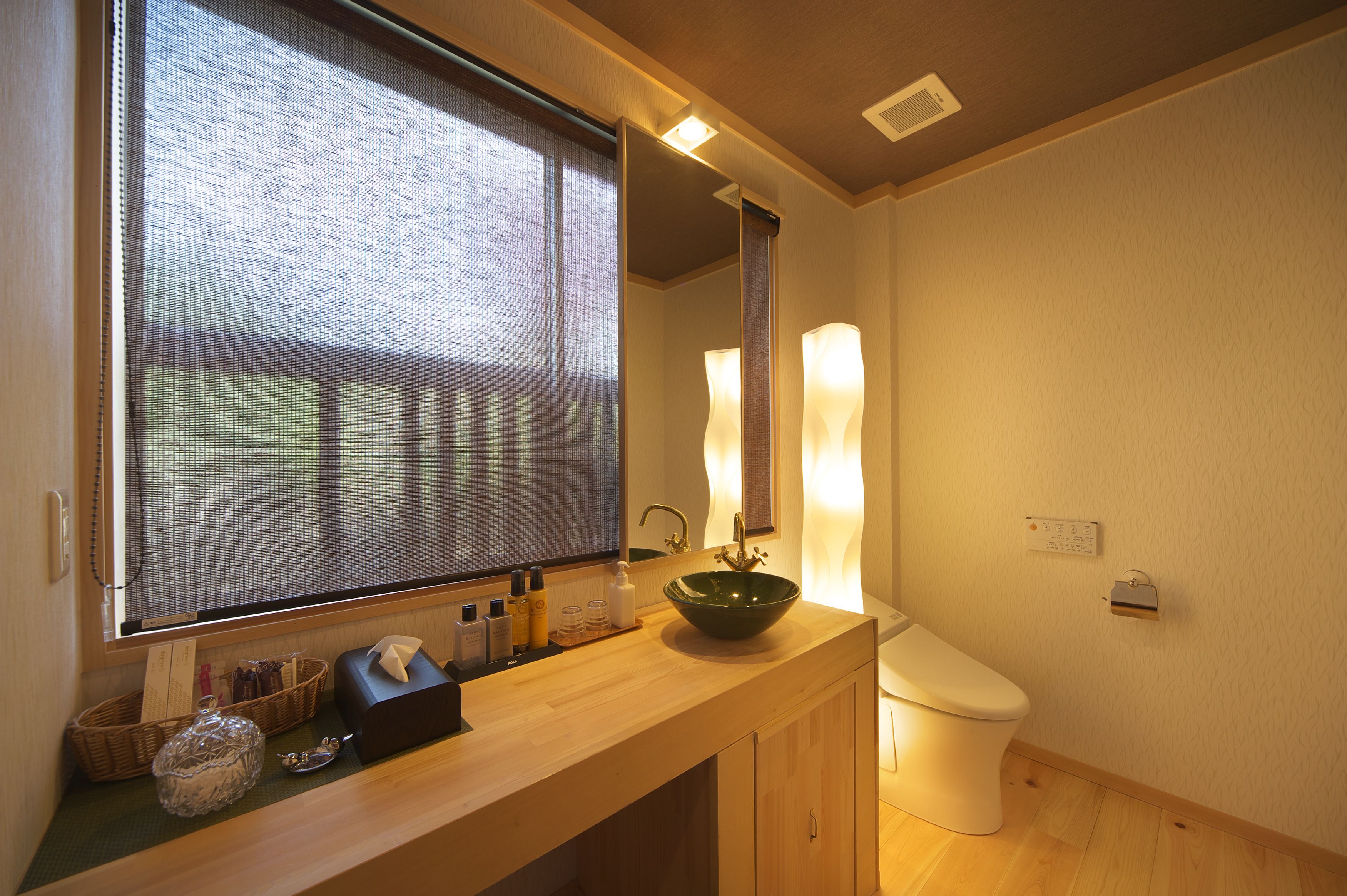 deluxe japanese style room with tatami area, open-air bath | bathroom | deep-soaking bathtub, free toiletries, hair dryer, slippers