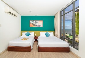 Deluxe Triple Room | Minibar, in-room safe, desk, laptop workspace - May Beach Hotel (Da Nang)