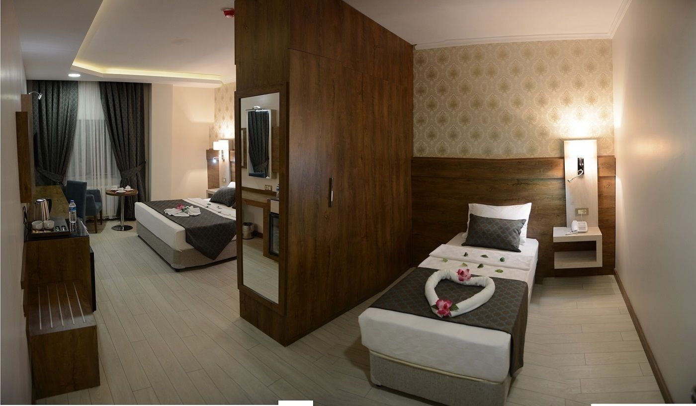 family room | 1 bedroom, premium bedding, minibar, in-room safe