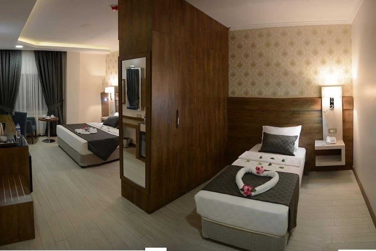 family room | 1 bedroom, premium bedding, minibar, in-room safe