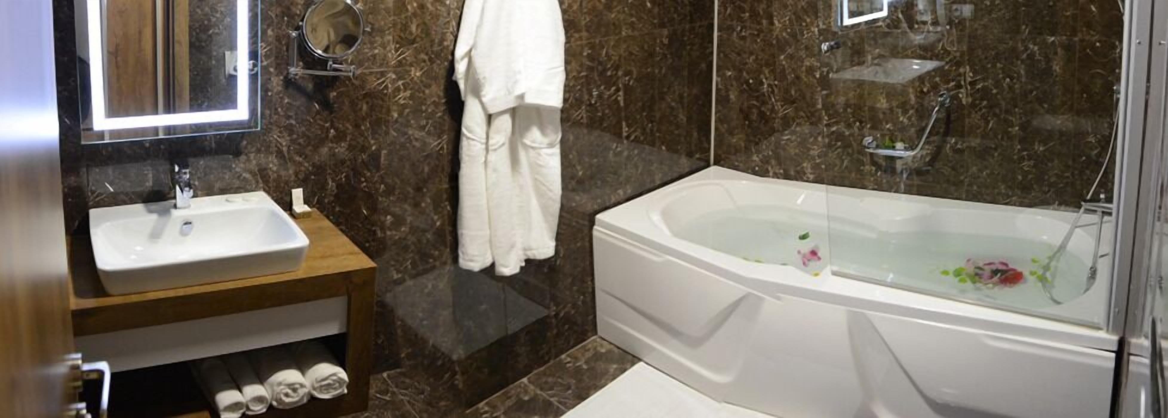 premier suite | bathroom | free toiletries, hair dryer, slippers, towels