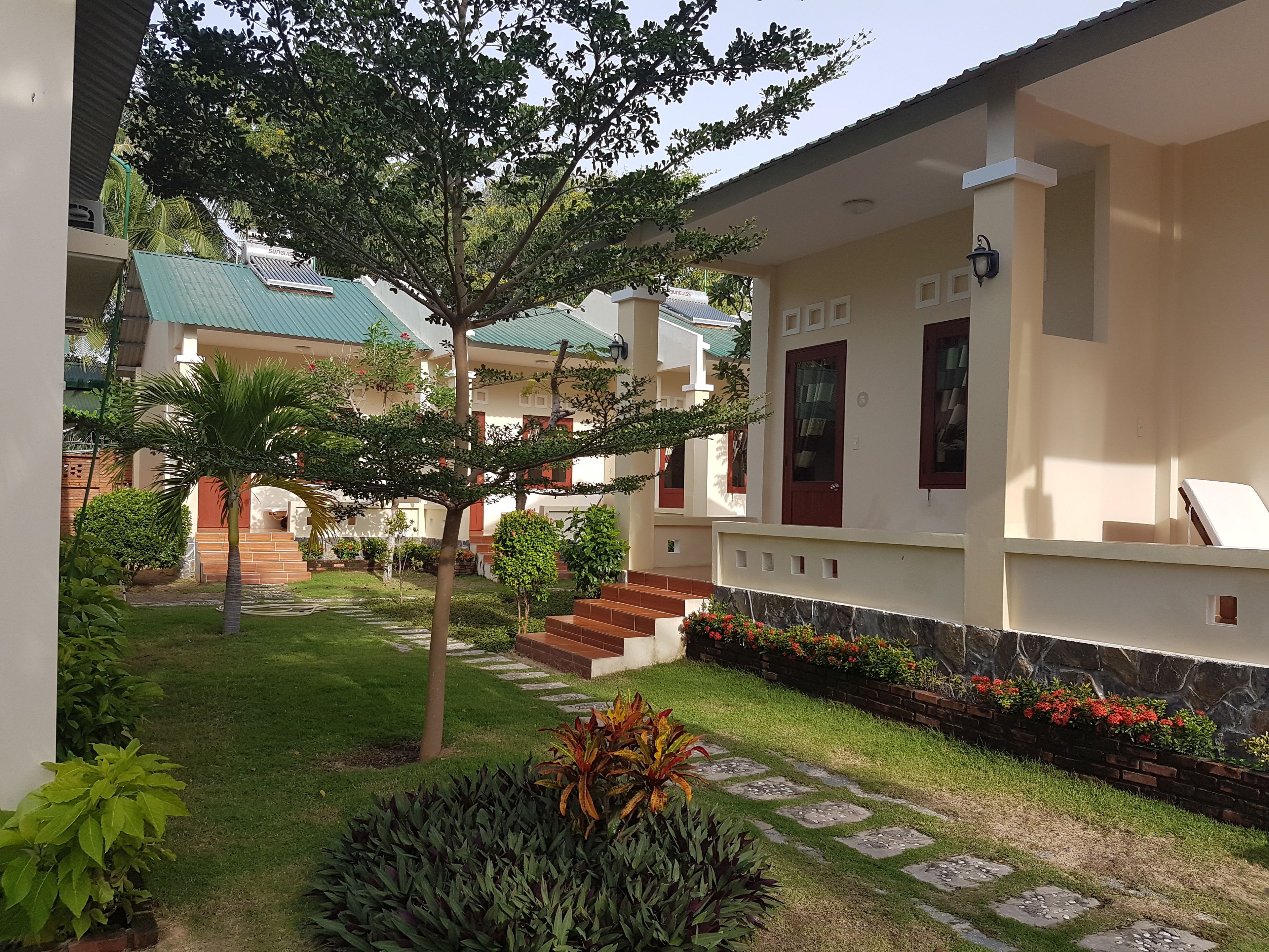 deluxe quadruple room, 2 queen beds, non smoking, garden view | terrace/patio