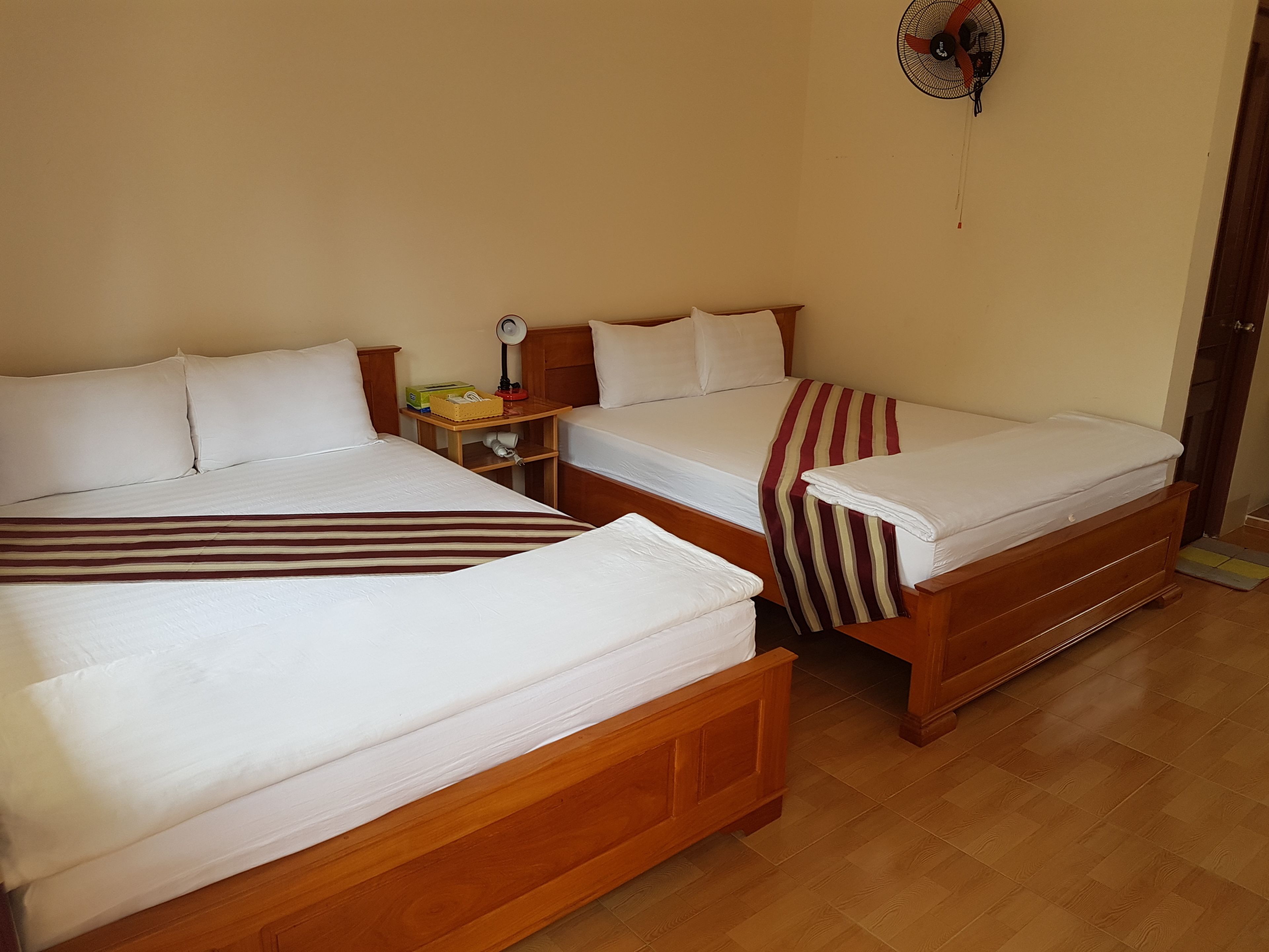 deluxe quadruple room, 2 queen beds, non smoking, garden view | minibar, in-room safe, individually furnished, free wifi