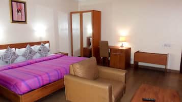 Premium bedding, desk, laptop workspace, blackout curtains