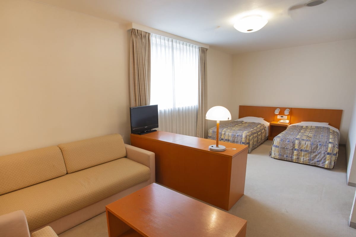 Desk, laptop workspace, blackout curtains, free WiFi