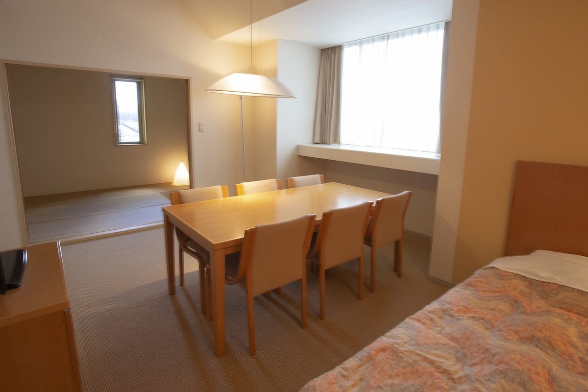 Desk, laptop workspace, blackout curtains, free WiFi