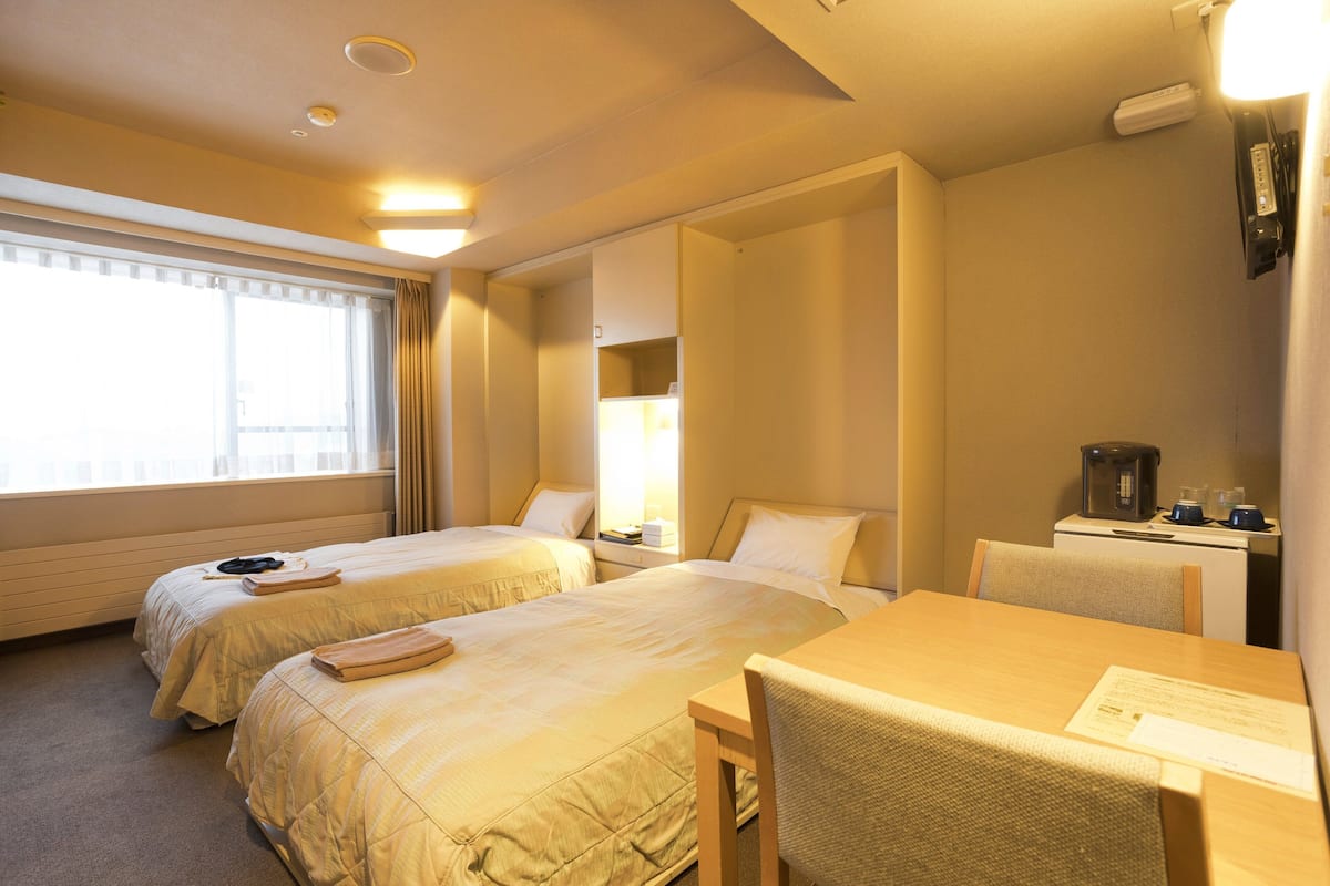 Desk, laptop workspace, blackout curtains, free WiFi