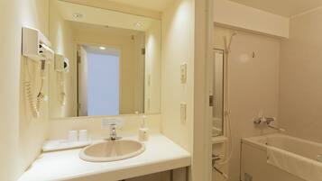 Combined shower/tub, deep soaking tub, free toiletries, slippers