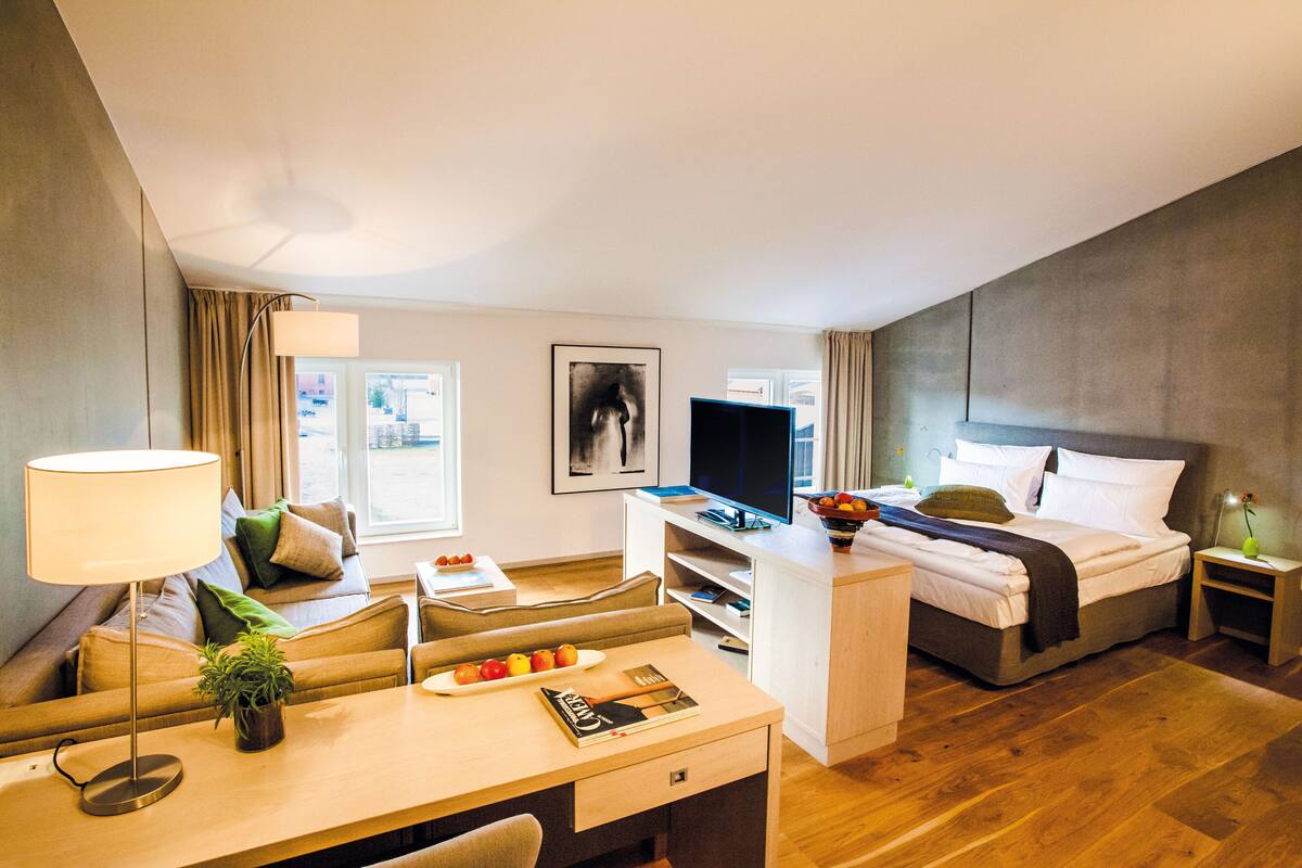 junior suite | 1 bedroom, in-room safe, desk, iron/ironing board