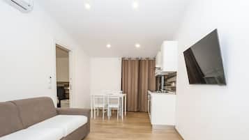 Family Condo | Living area | 32-inch Smart TV with digital channels, Netflix, streaming services