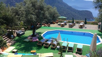 Seasonal outdoor pool, pool umbrellas