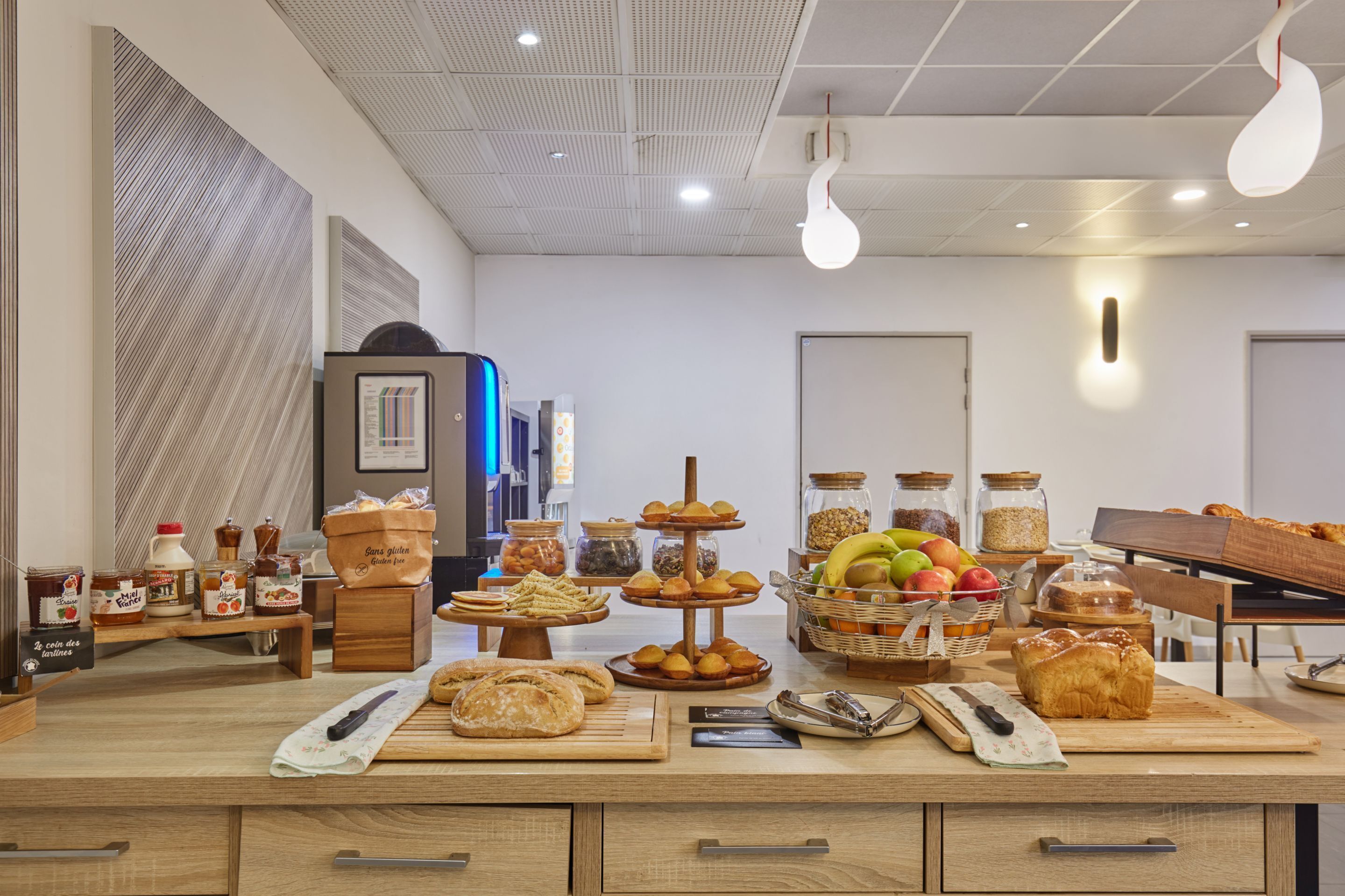 A breakfast buffet with various food items and a coffee station.
