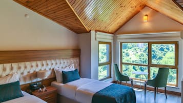2 habitaciones, ropa de cama de alta calidad y minibar
