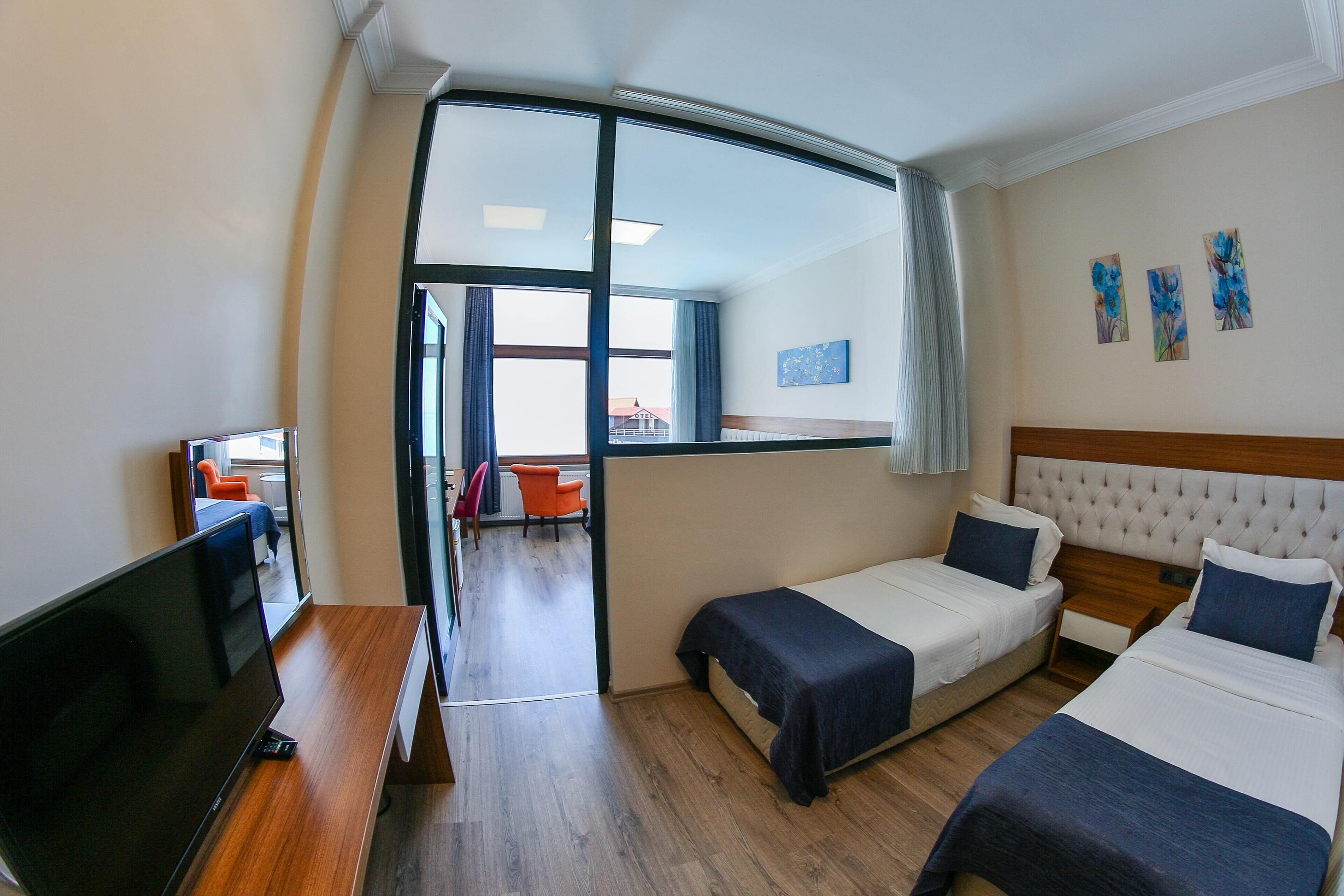 family room, 1 bedroom | 2 bedrooms, premium bedding, minibar, in-room safe