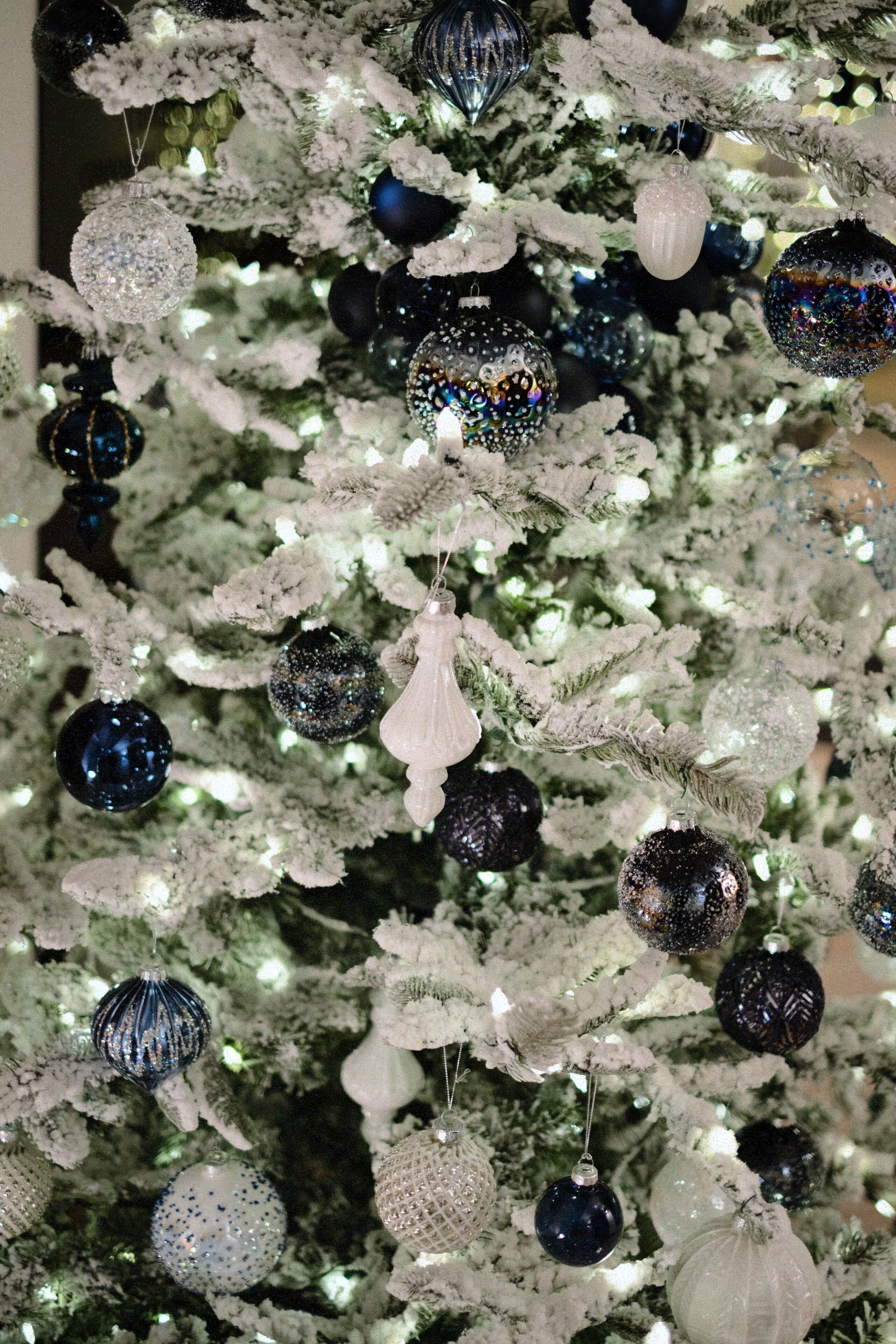 A Christmas tree with various ornaments.