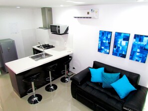 Apartment, 1 Bedroom | Living area | 32-inch plasma TV with cable channels, TV
